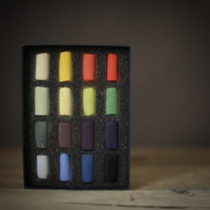 Set of 16 half sticks of soft pastels in a variety of vibrant hues. 